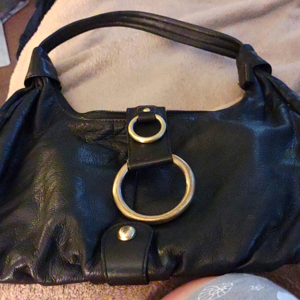 Michael Rome black leather bag with gold color hardware.